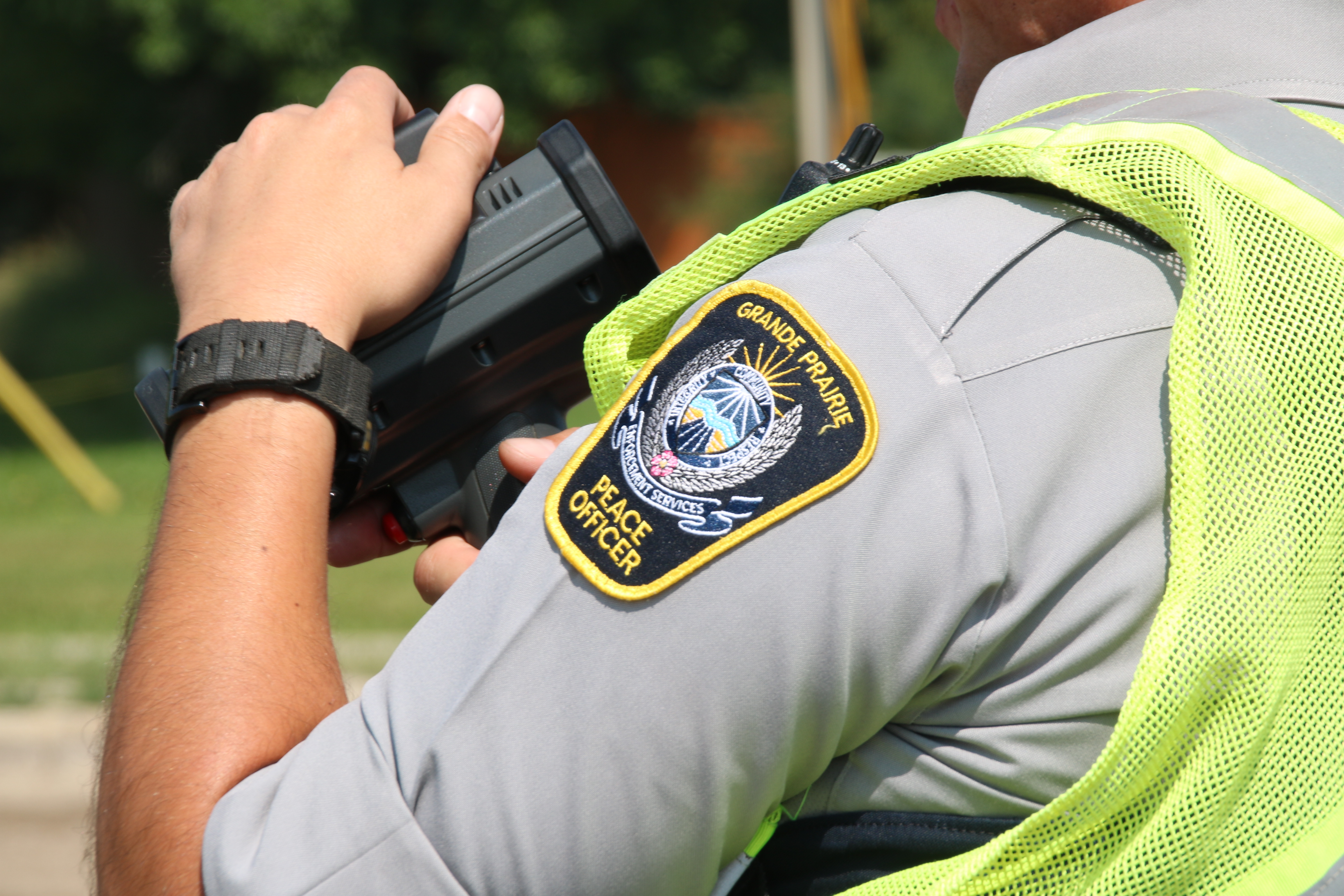 A Peace Officer holding speed Lidar